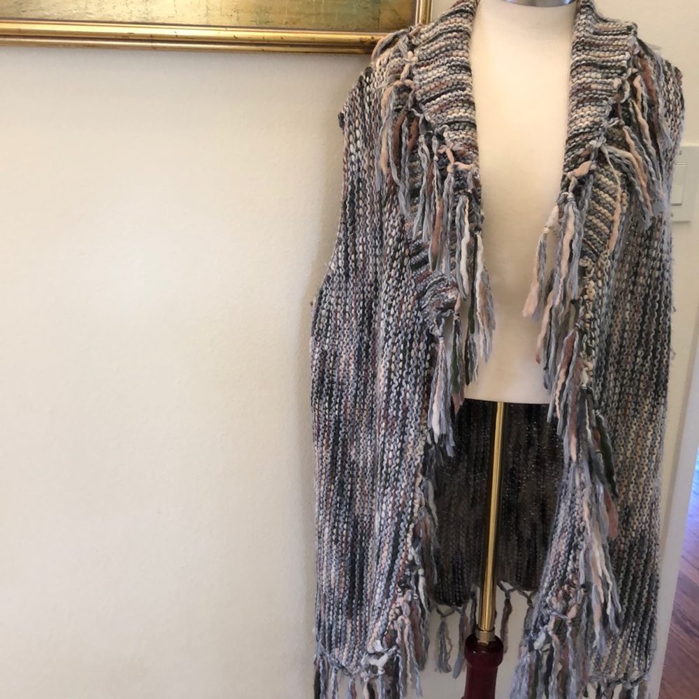 Long sleeveless sweater vest